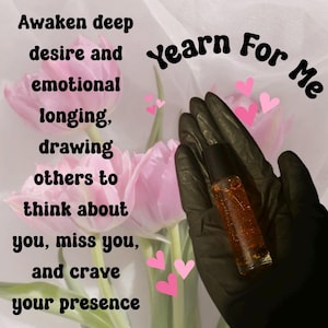 May include: A small, clear glass bottle with a black cap, filled with a shimmering amber liquid, held by a gloved hand. The text "Yearn For Me" is above the bottle. Pink tulips and hearts are in the background, with text about desire.
