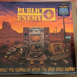 May include: A Public Enemy vinyl record cover titled What You Gonna Do When The Grid Goes Down? featuring a desert landscape with a boombox, a broken computer monitor, a turntable, and candles. The text Public Enemy is at the top.