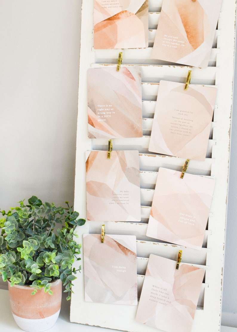 NICU Mama Affirmation Cards from Fourth Trimester Mama displayed on the wall