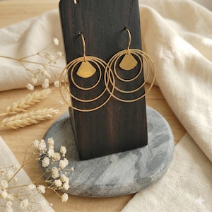 Gold-plated hoop earrings in stainless steel with a fan-shaped triangle design. Women's jewelry. Handmade jewelry gift.
