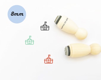 May include: A set of three 8mm wooden stamps with a school building design. The stamps are in black, green, and red. The stamps are labeled "Just Go Stamps".