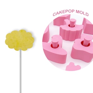 May include: Pink cake pop mold with a ballerina design. The mold is made of silicone and has a non-stick surface. CAKEPOP MOLD is written in white text on a pink circle.