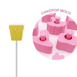 May include: Pink cake pop mold with a variety of shapes, including a flower, a swan, and a heart. The mold is made of silicone and is designed to create cake pops that are easy to remove. The mold is labeled "Cakepop Mold".