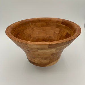 Cherry segmented bowl with maple veneer accents