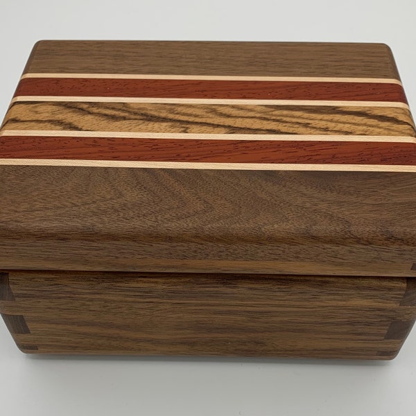 Black walnut jewelry box with an inlay of zebra wood, padauk , and maple