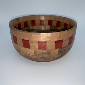 Segmented walnut bowl with padauk accents