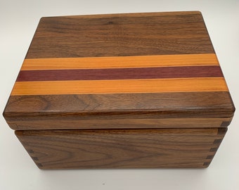 Black walnut jewelry box with an inlay of rosa peroba, purpleheart, and maple
