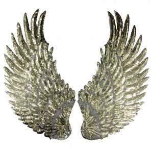 May include: A pair of gold sequined angel wings. The wings are made of a mesh fabric with sequins sewn on. The wings are about 10 inches tall and 6 inches wide.