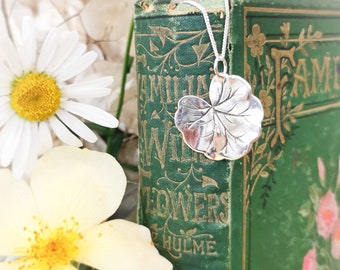 Silver Lily Pad Pendant. A pretty and tactile everyday pendant that sits beautifully against the chest and catches the light.