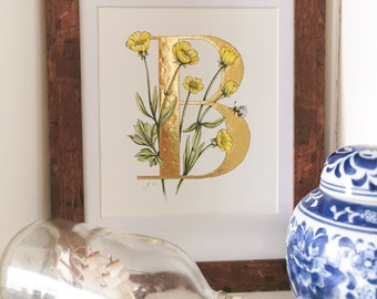 B is for Buttercup gouache and gold leaf artwork. A gold letter B with intertwined buttercups and a bumblebee. Christening gift idea.