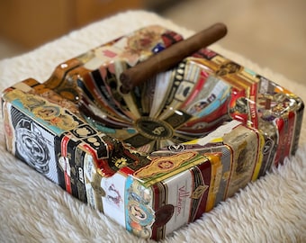 Custom square ashtray covered with cigar bands and epoxy resin.