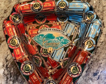Custom order triangular ashtray covered with cigar bands