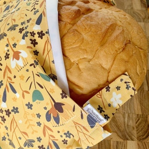 Reusable Sourdough Bread Bag keeping bread fresh and soft, with waterproof liner. Amazing bread storage, and great to store baked goods too.