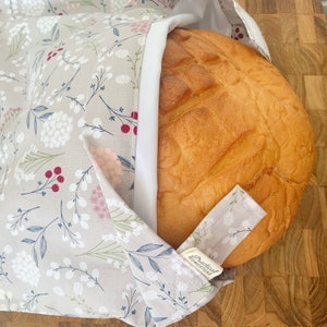 Reusable Sourdough Bread Bag keeping bread fresh and soft, with waterproof liner. Amazing bread storage, and great to store baked goods too.