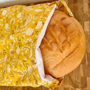 Reusable Sourdough Bread Bag keeping bread fresh and soft, with waterproof liner. Amazing bread storage, and great to store baked goods too.