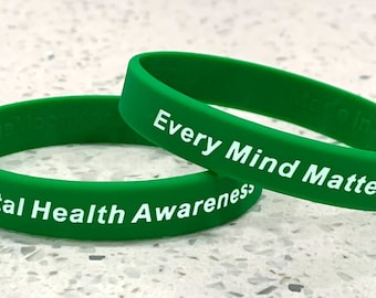 May include: Two green silicone wristbands with white text. One band reads "Every Mind Matters" and the other reads "Mental Health Awareness".