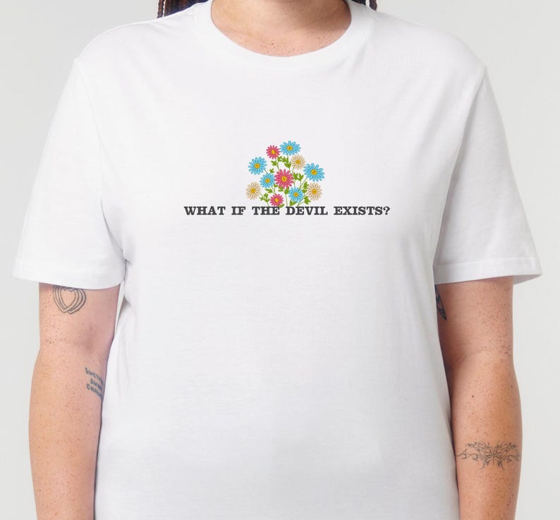 Embroidered white organic cotton t-shirt. The embroidery consists of flowers and text that reads "What if the devil exists?"