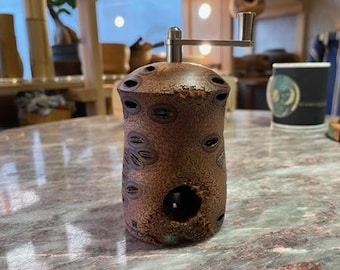 Nutmeg mill made from Banksia cones (Australia)