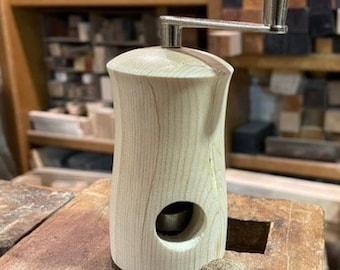 Nutmeg mill made of pine wood
