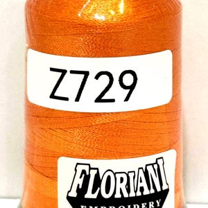 May include: A spool of orange embroidery thread with a black base and top. The label reads "Z729" in large black letters. The "Floriani Embroidery" logo is also visible on the label.