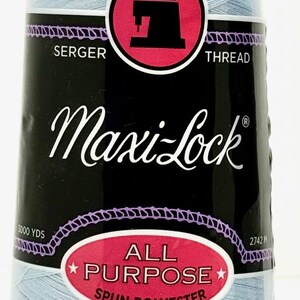 May include: A spool of light blue Maxi-Lock serger thread. The spool is labeled "All Purpose Spun Polyester" and has a sewing machine icon on it. It is 3000 yards (2742 meters) long.