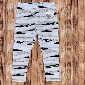 Mummy themed pants, White & Black with glow in the dark eyes.  Fun infant, toddler, kids pants. Play pants, dress up clothes, Halloween