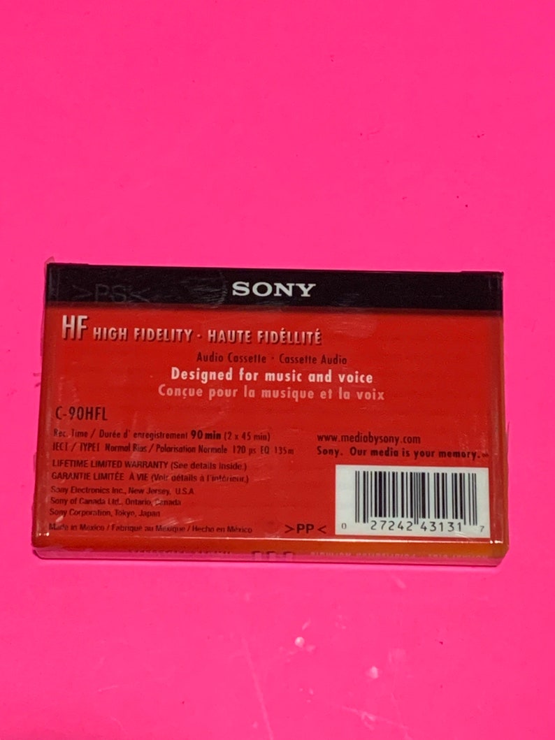 May include: A red and black Sony HF High Fidelity audio cassette tape. The packaging includes text in English and French, with details about recording time and warranty information. The cassette is designed for music and voice.