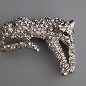 Vintage 1980s Large statement Deco Style silver tone with clear crystal and faux emerald eyes big cat brooch