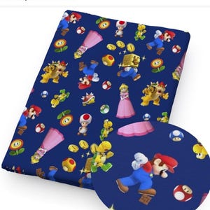 May include: A dark blue fabric featuring a repeating pattern of characters and elements from the Super Mario video game series. The design includes Mario, Princess Peach, Bowser, coins, mushrooms, and other iconic imagery.