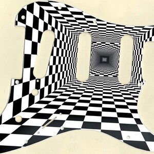 May include: A black and white checkered guitar pickguard with a 3D optical illusion design.