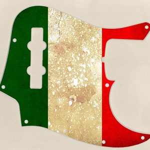 May include: A green, white, and red guitar pickguard with a distressed, aged look. The pickguard is designed to fit a Fender Precision Bass guitar.