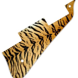 May include: A guitar pickguard featuring a tiger print design. The pickguard is made from a durable material and is designed to fit most electric guitars.