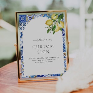 Puede incluir: Un cartel con marco dorado, fondo blanco y borde de azulejos azules y amarillos. El cartel dice "available in 9 sizes" y "CUSTOM SIGN". El texto debajo dice "Use this editable sign template to create and print unlimited signs for your event".