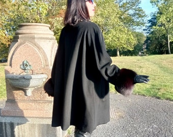 Vintage luxurious 1990s black cashmere and wool swing coat with black fox fur cuffs very elegant Claire of Paris