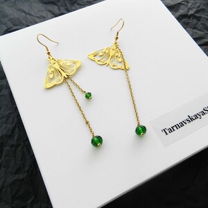 Golden luna moth butterfly drop earrings - chains mismatched earrings with green crystals