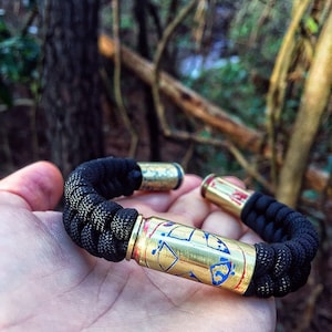 Captain America Shield .50ae black paracord550 copper wire bracelet with 45acp casings hand etched and patinated