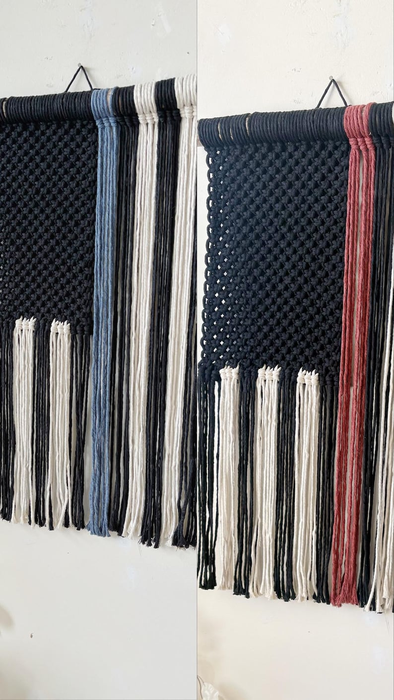 May include: Two macrame wall hangings with black, white, and blue yarn. The left hanging has a blue and white striped pattern, while the right hanging has a red and white striped pattern.