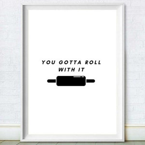 May include: Black and white printable wall art with the text "You gotta roll with it" and a black rolling pin illustration.