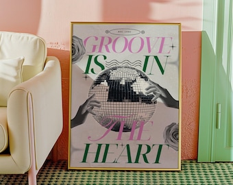 May include: A gold framed poster with a disco ball and the text "GROOVE IS IN THE HEART" in pink and green letters. The poster has a retro design.