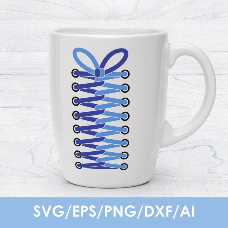 May include: A white ceramic mug with a blue and light blue shoelace design. The shoelace is tied in a bow at the top.
