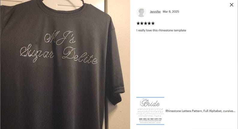 May include: A dark gray short-sleeved t-shirt featuring the text MJ's Sugar Delite spelled out in small, clear, reflective rhinestones arranged in a cursive script font across the chest area of the garment.