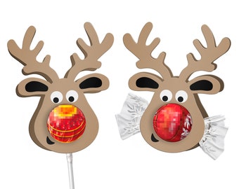 Peut inclure: Deux découpes en carton en forme de renne de couleur beige avec des bois marron et des détails d'oreilles noirs. L'une présente une sucette rouge ronde sur un bâton blanc, l'autre un bonbon rouge rond emballé dans du plastique transparent.