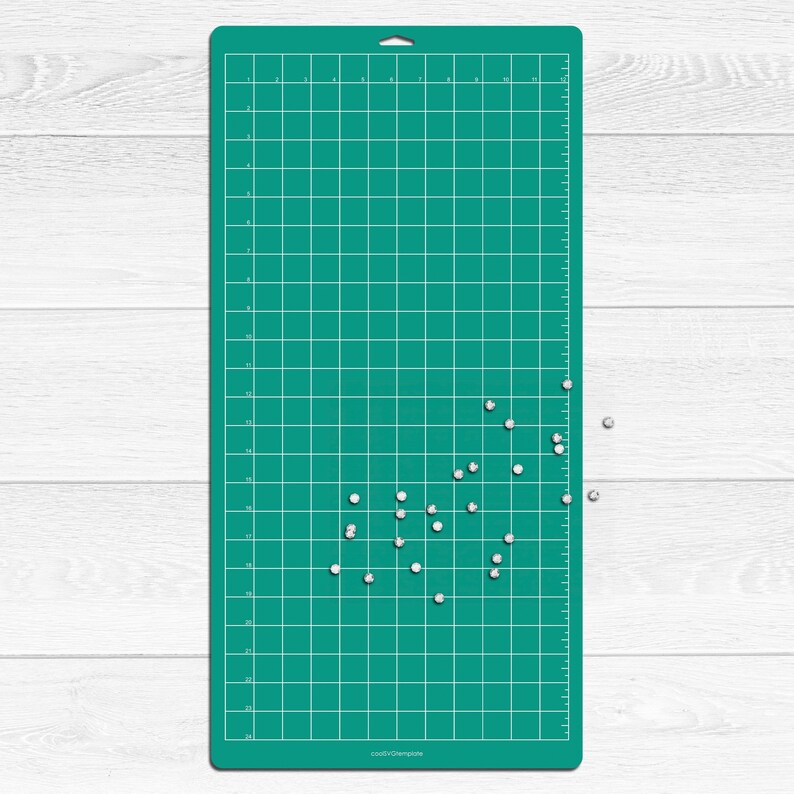 May include: A green self-healing cutting mat with a grid pattern and white dots scattered across the surface. The mat has a ruler on the right side and the text "coolDIYtemplate" in the bottom right corner.