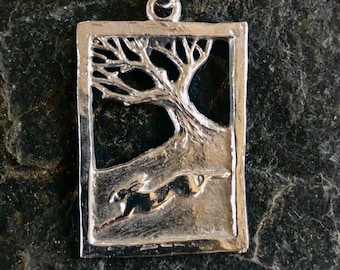 Hare running through wood pendant necklace