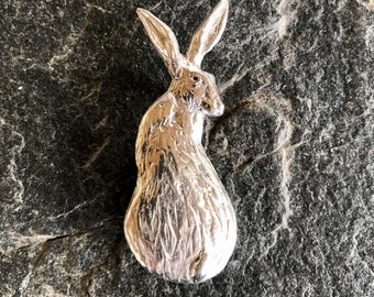 Hare looking over shoulder brooch in pewter