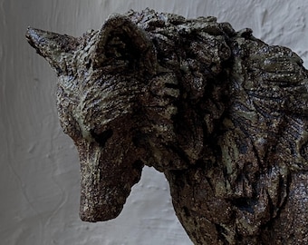 Wolf sculpture in ceramic stoneware hand sculpted by Paul Szeiler