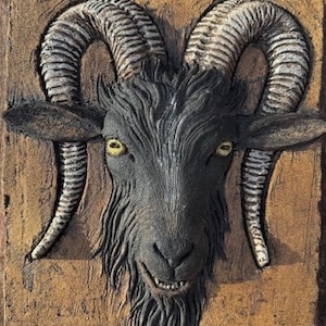 Wild Black Goat low relief sculpture in stoneware ceramic