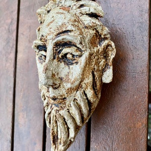 Man’s head wall sculpture by Paul Szeiler