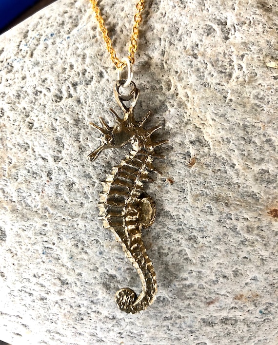 Seahorse pendant necklace in bronze by Paul Szeiler.