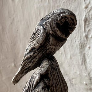 Owl on standing stone sculpture by Paul Szeiler